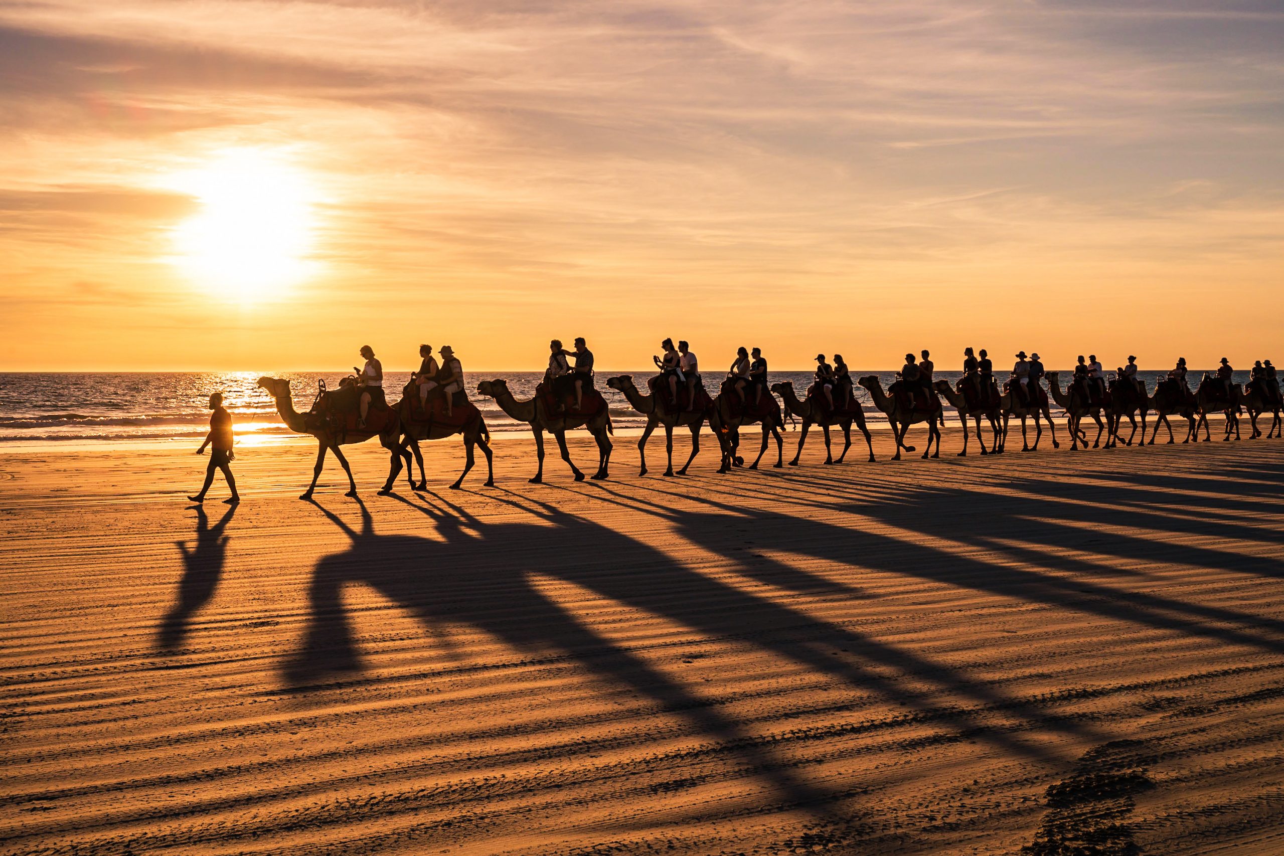 Group returning to hotel by camel with www.extraordinaryevents.co.uk